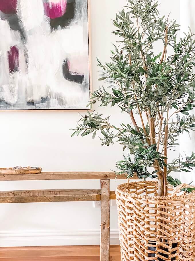 faux Olive tree in rattan basket