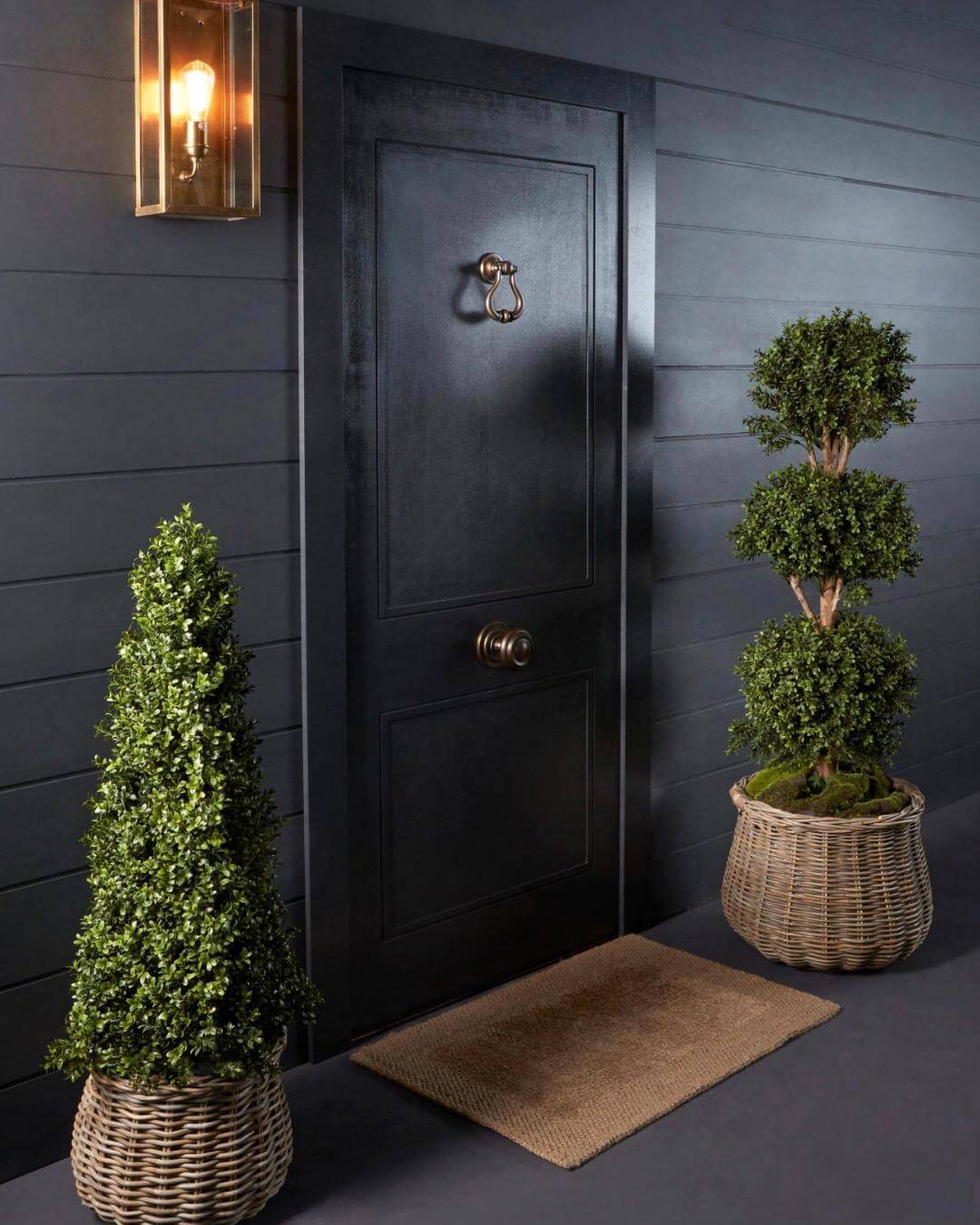 Topiary trees at a door entrance