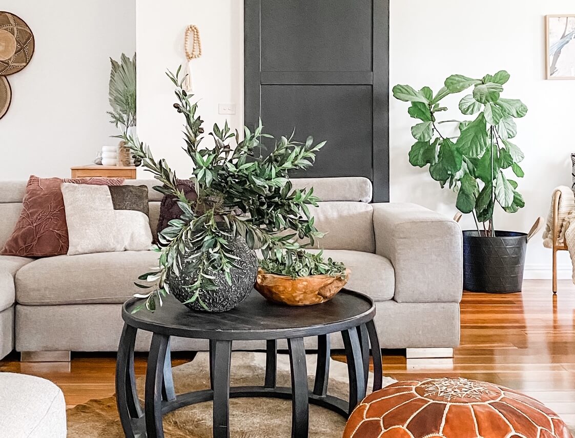 artificial trees and greenery in a living room