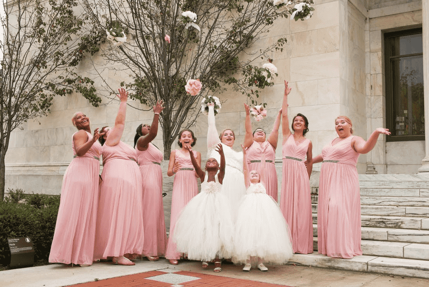 bride and bridesmaids in pink dresses