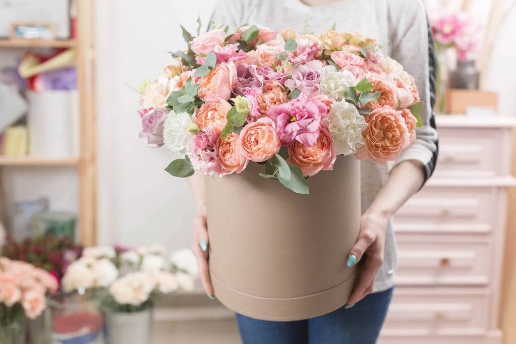 Large pot of multi-coloured artificial flowers