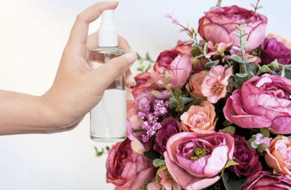 spray cleaning faux flowers with water