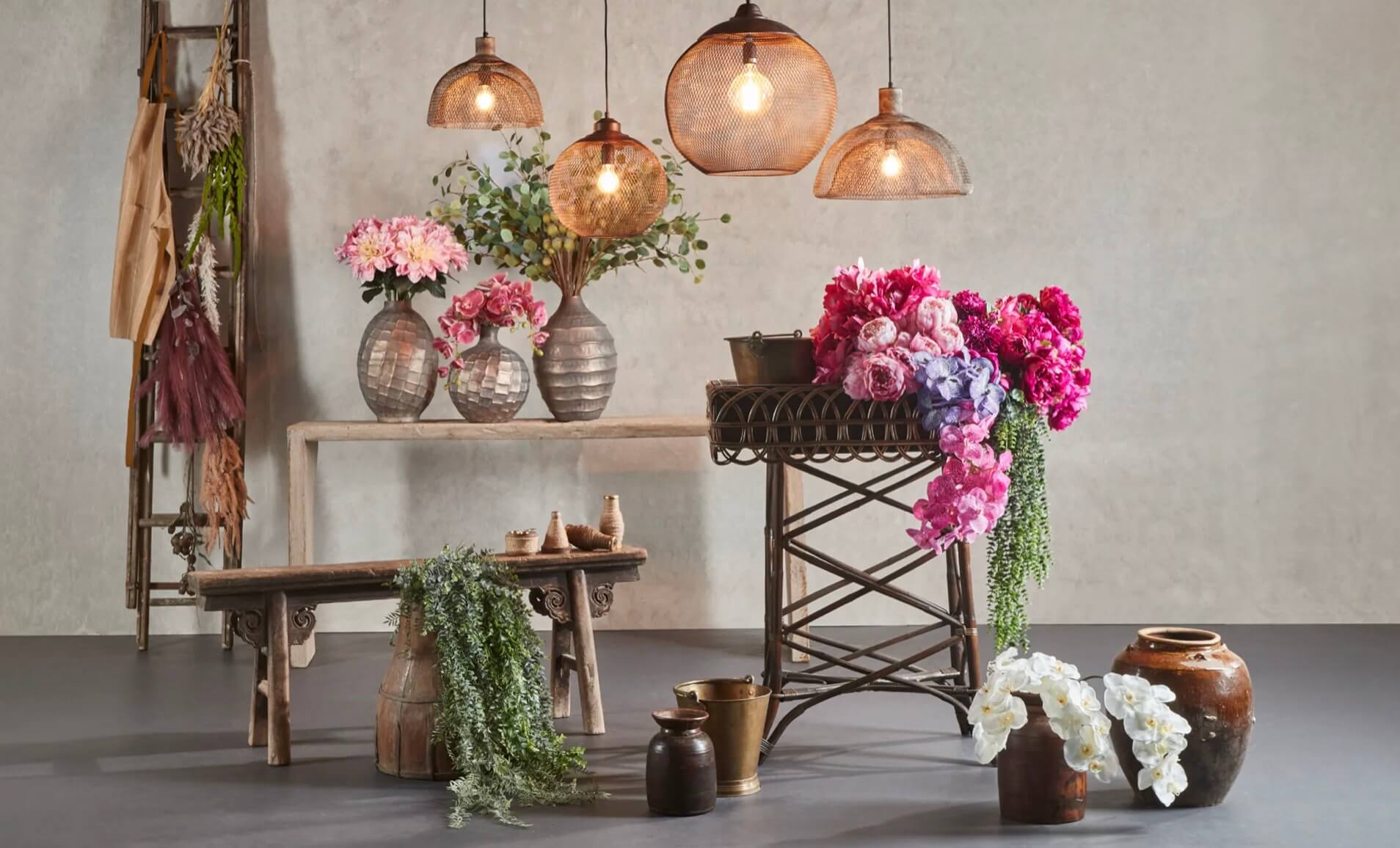 faux flowers on potting table