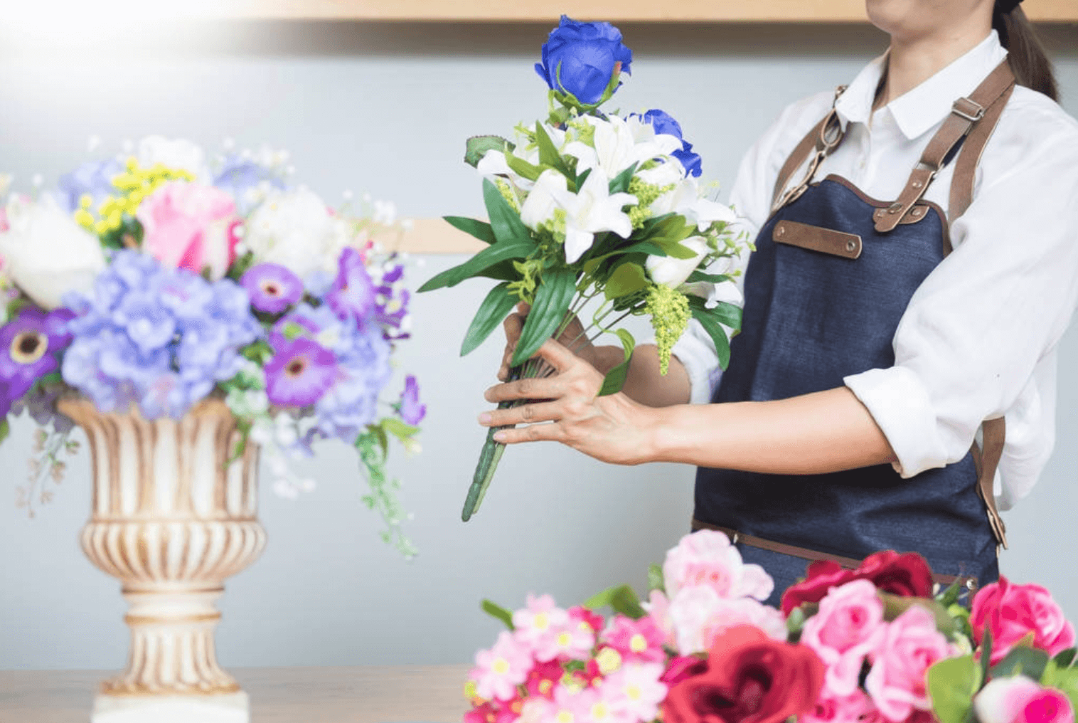 florist holding fake flowers