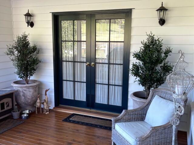 artificial plants and a front door