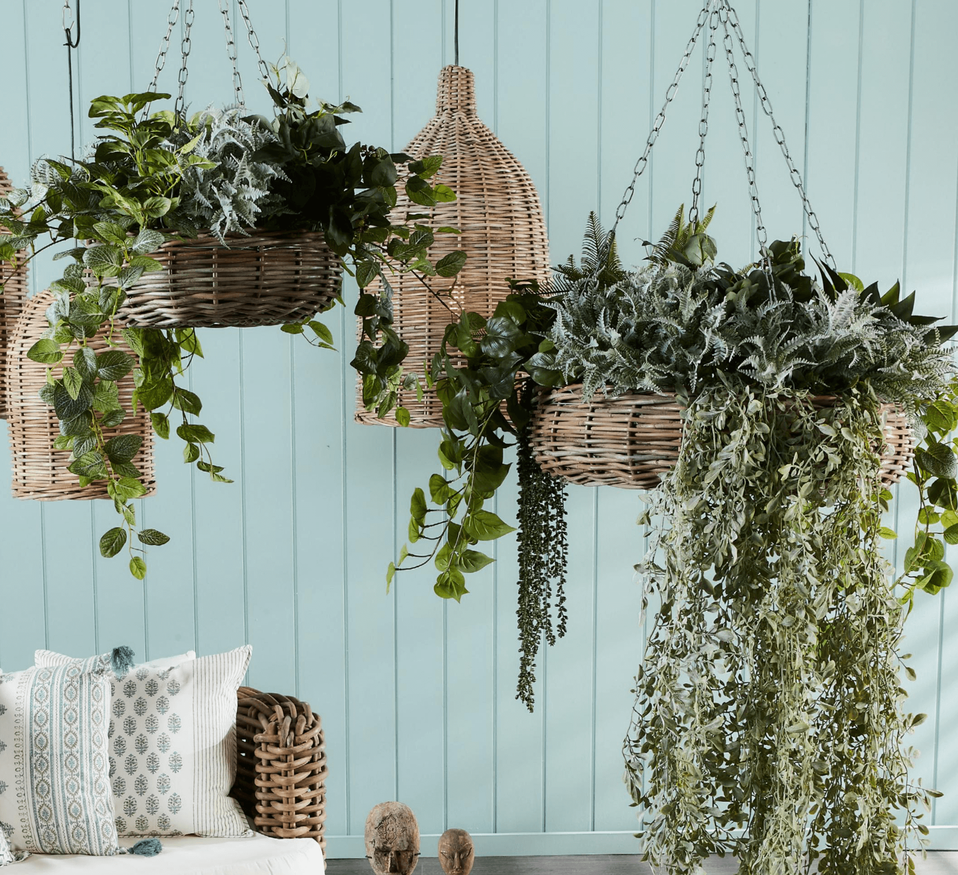faux greenery in hanging baskets
